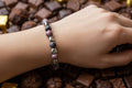 Mauve & Black Glass Bead Bracelet with Silver Heart Spacers