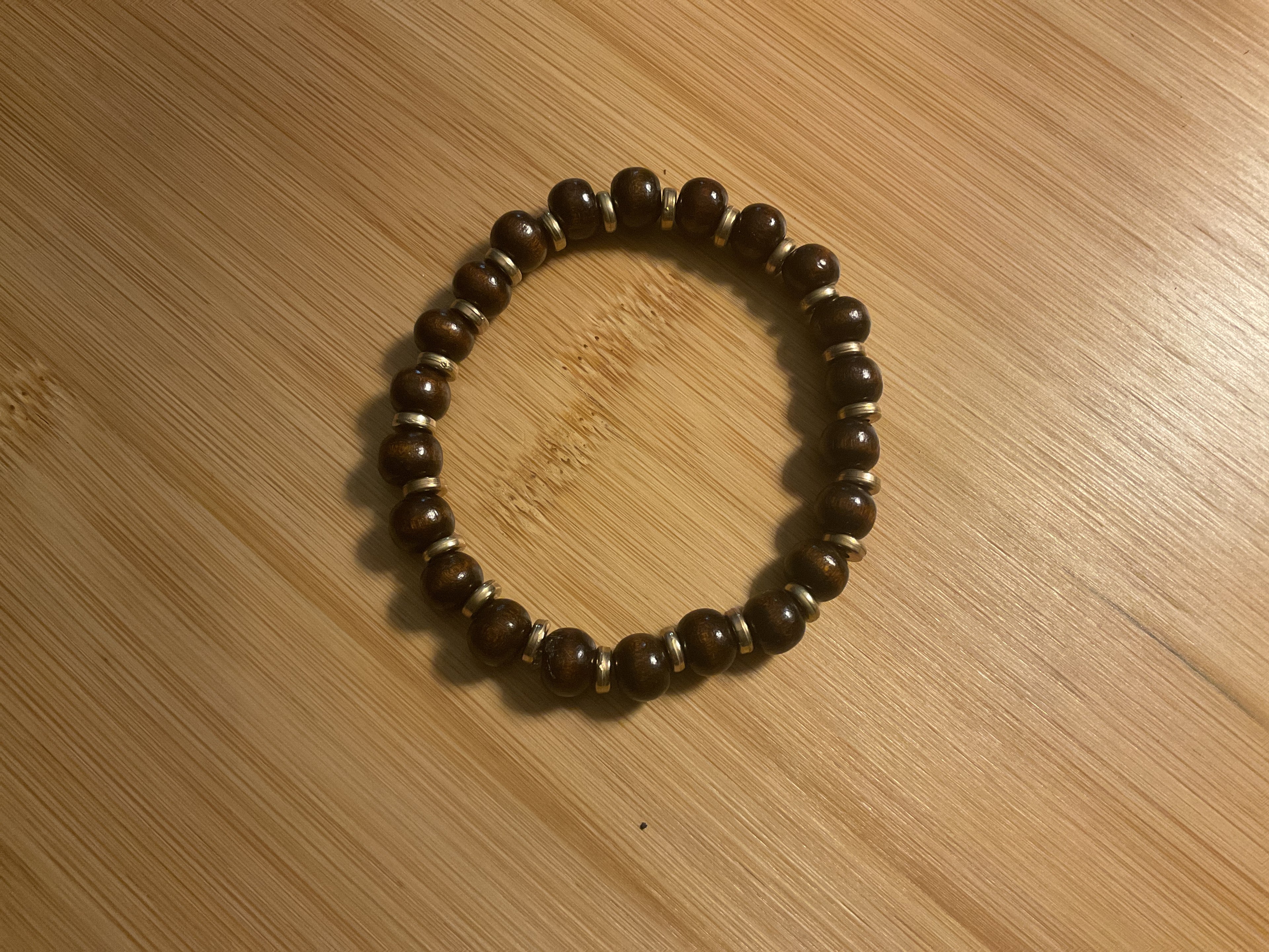 Dark Brown Round Bead Bracelet with Gold Color Spacers