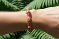 Light Brown Wood Bead Bracelet with Red Glass Beads & Silver Spacers